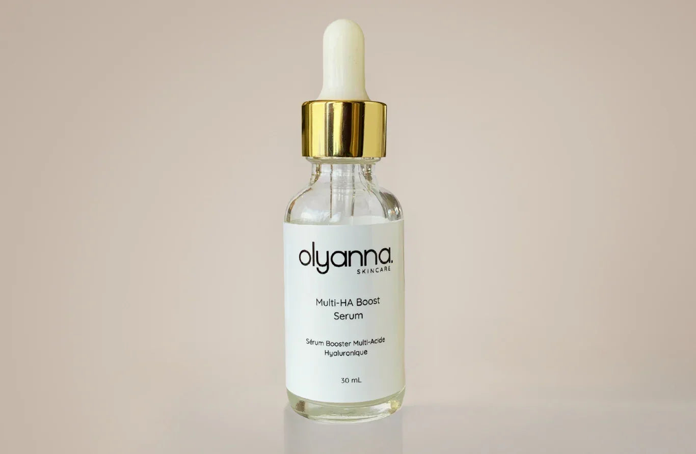 Olyanna skincare serum bottle with dropper on a beige background