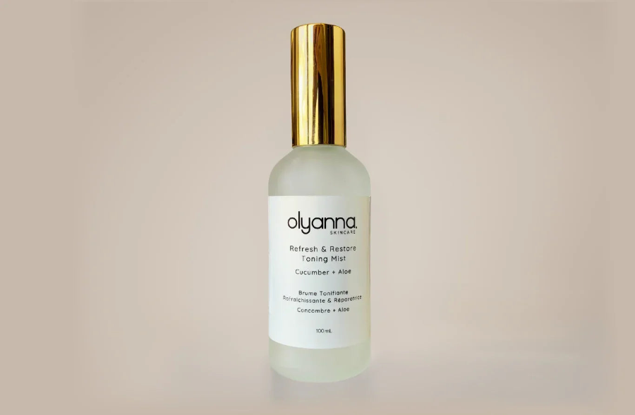 Olyanna skincare bottle on a beige background